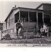 Family outside their home in Jumbo Gardens